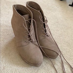 Taupe wedged booties.